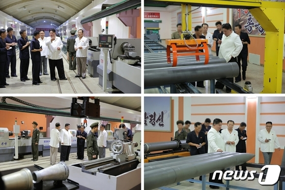 North Korean state media photos from February 2023 show Kim inspecting tactical missile production plants and other military factories, but at that time, the faces of civilian-clad officials were deliberately blurred. / Rodong Sinmun