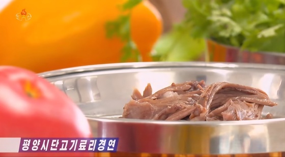 Pyongyang Dog Meat Cooking Competition was held at Hwasong-gak in Pyongyang / Capture from Korean Central Television