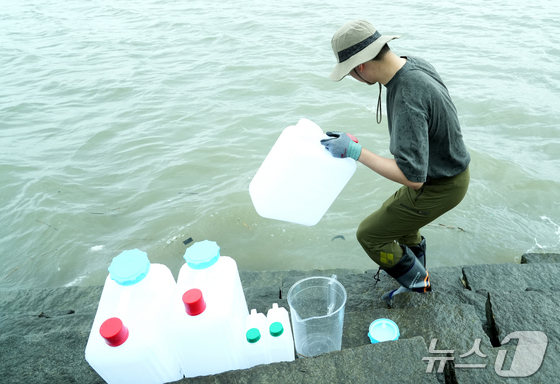 An expert from the Korea Institute of Nuclear Safety collected samples in Ganghwa-do. / Photo courtesy of the Nuclear Safety and Security Commission of South Korea