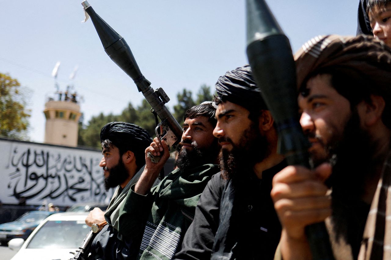 Taliban soldiers celebrate during an anniversary event in Kabul, Afghanistan, in August 2023. (Reuters-Yonhap)]