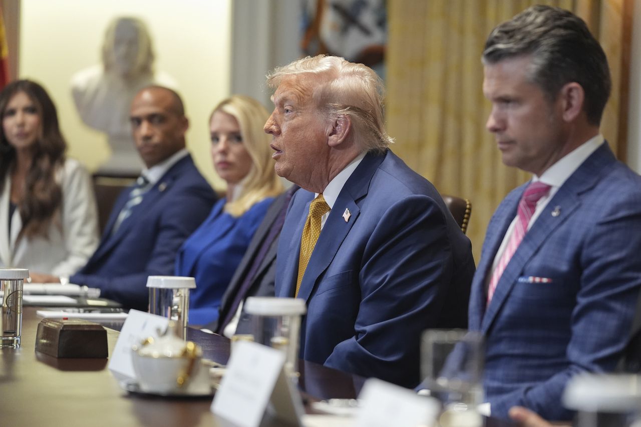 US President Donald Trump (center) speaks during a Cabinet meeting at the White House, Tuesday, in Washington. (AP-Yonhap)]