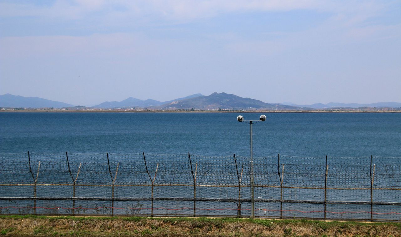 This photo shows the Demilitarized Zone (DMZ), a heavily fortified buffer area separating North and South Korea. (Getty Images)]