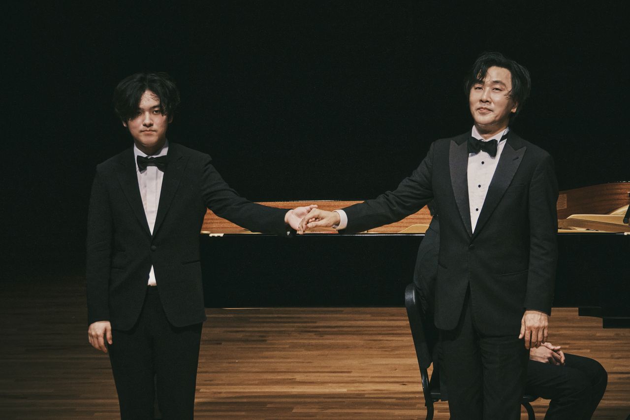 Pianists Lim Yunchan (left) and Sohn Min-soo greet the audience after a recital at the Seoul Arts Center on Tuesday. (MOC)