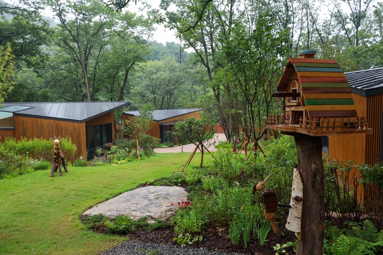 Wooden lodges and playful forest-themed details are seen at Surak Hue on Wednesday, ahead of its public launch as Seoul's first urban forest retreat. (Nowon-gu Office)