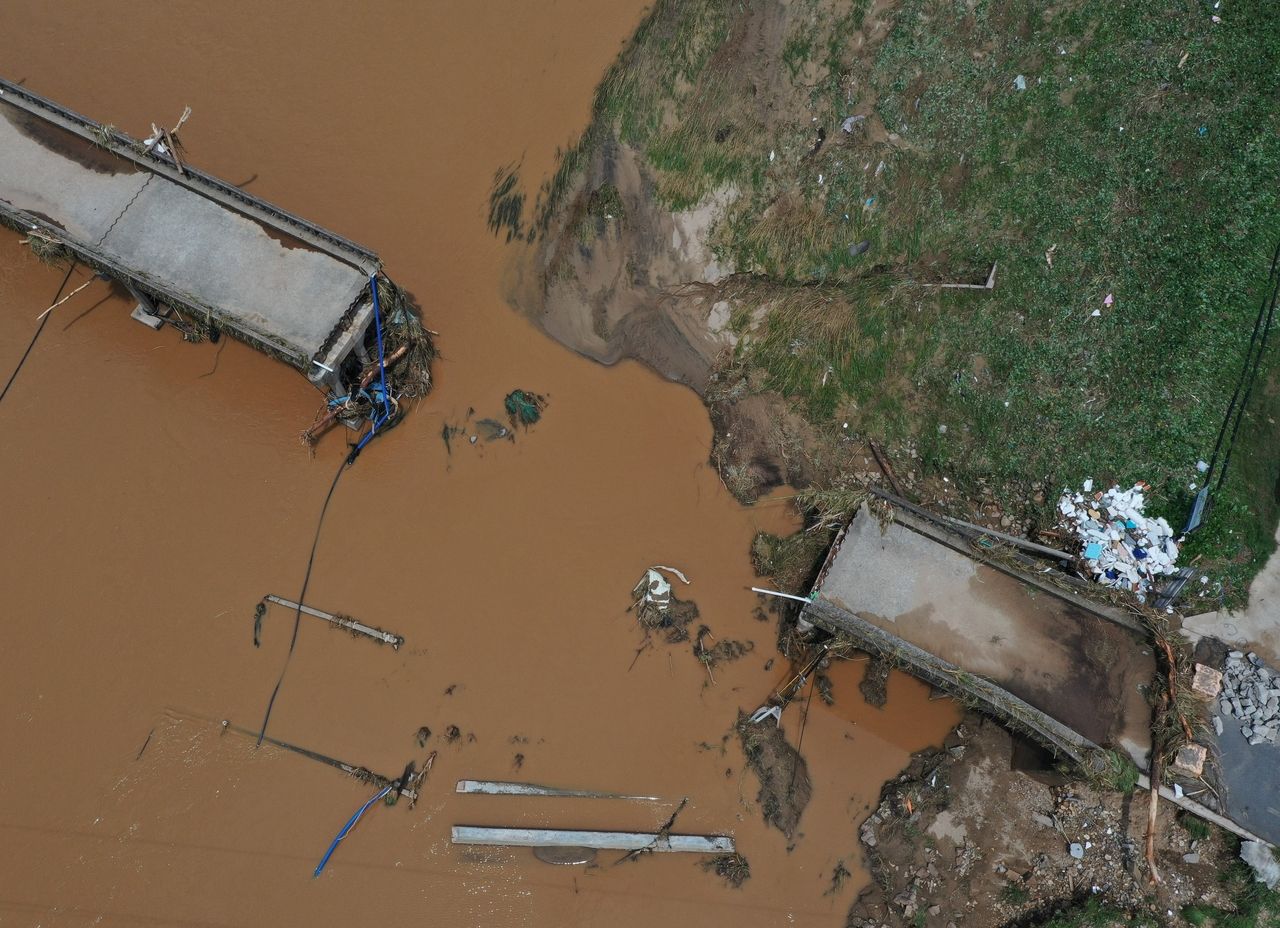 A bridge in Sancheong, South Gyeongsang Province, was torn apart by severe flooding after the area was hit with 793.5 millimeters of cumulative rainfall between July 16 and 20. (Yonhap)]