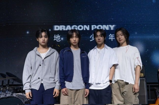 From left: Dragon Pony members Pyun Sung-hyun, Kwon Se-hyuk, An Tae-gyu and Ko Gang-hun pose for a photo during the press conference held in Mapo-gu, Seoul, Tuesday. (Antenna)