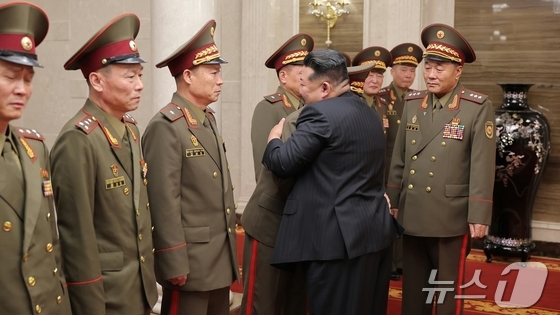 The Rodong Sinmun, the official newspaper of the Workers\' Party of Korea, published a photo of Kim Jong Un, General Secretary of the Workers\' Party, meeting with key commanders of the Korean People\'s Army\'s overseas operations forces who returned home on August 20 to attend the Democratic People\'s Republic of Korea\'s National Award Ceremony. The person standing to the right of Kim Jong Un is Kim Yong Bok / Rodong Sinmun