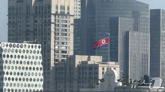 The North Korean flag flutters on the rooftop of the main building of the North Korean Embassy in Beijing, China\'s diplomatic district.2025.8.31 / News1