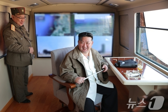 Kim Jong Un, General Secretary of the Workers\' Party of Korea, attends a test launch of the latest anti-aircraft (surface-to-air) missile weapon system at a military industrial enterprise in North Korea on March 20 / Rodong Sinmun