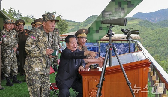 The Rodong Sinmun, North Korea\'s state-run newspaper, reported on Tuesday that a firing drill competition involving tactical artillery units under the Korean People\'s Army\'s combined forces took place on Monday. The report confirmed that Yoo Chang-sun (pictured left in the center) has been appointed as the new director of the Artillery Bureau within the General Staff Department / Rodong Sinmun