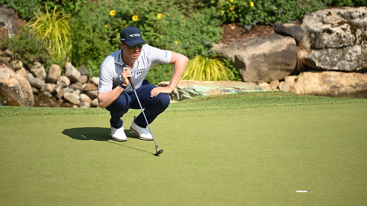 Ben Griffin lines up a putt