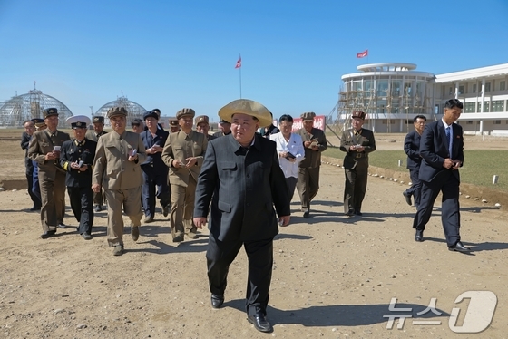 North Korea\'s ruling Workers\' Party\'s newspaper Rodong Sinmun reported on Friday that General Secretary Kim guided the construction of the Sinuiju Greenhouse Complex Farm and regional development projects on-site the previous day / Rodong Sinmun