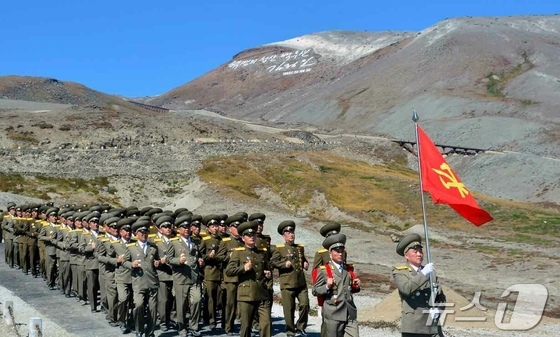 The Rodong Sinmun, the official newspaper of North Korea\'s Workers\' Party, reported on September 13 that a meeting of military personnel from the Ministry of Social Security was held on the previous day at the summit of Paektu Mountain, the sacred mountain of the revolution, to adopt a letter of loyalty addressed to Comrade Kim Jong Un, the Party\'s General Secretary, on the occasion of the 80th anniversary of the Party\'s founding / Rodong Sinmun