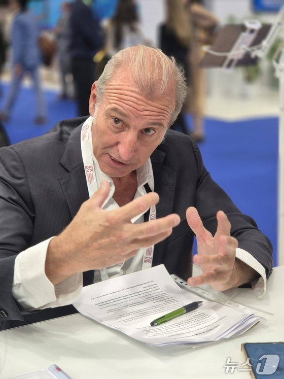 Fernando de Mora, Professor at the School of Pharmacy of the Autonomous University of Barcelona, Spain, is interviewed at Celltrion\'s booth at the European Association of Dermatologists (EADV) / News1