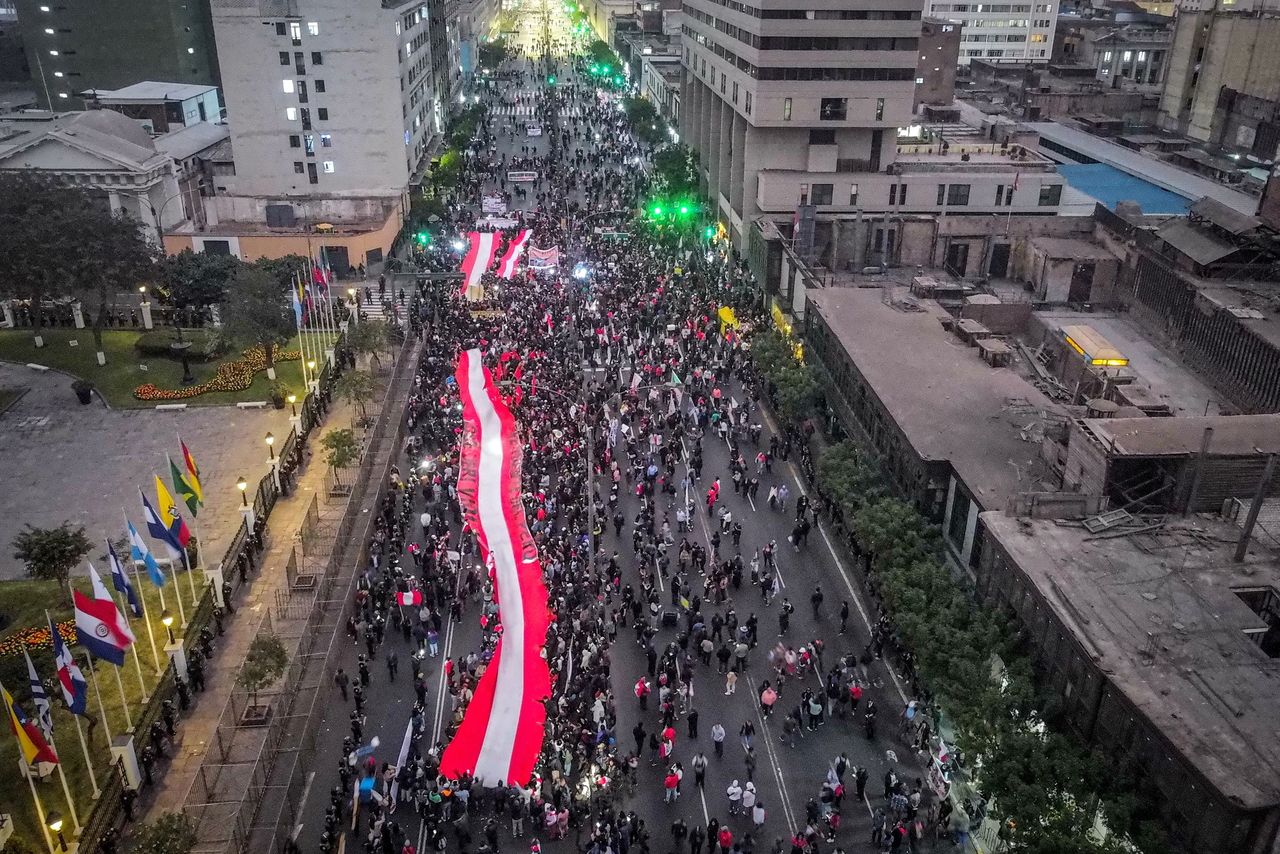 Aerial photograph shows people holding a flag at a protest in Lima, Peru, Oct. 15. (EPA-Yonhap)