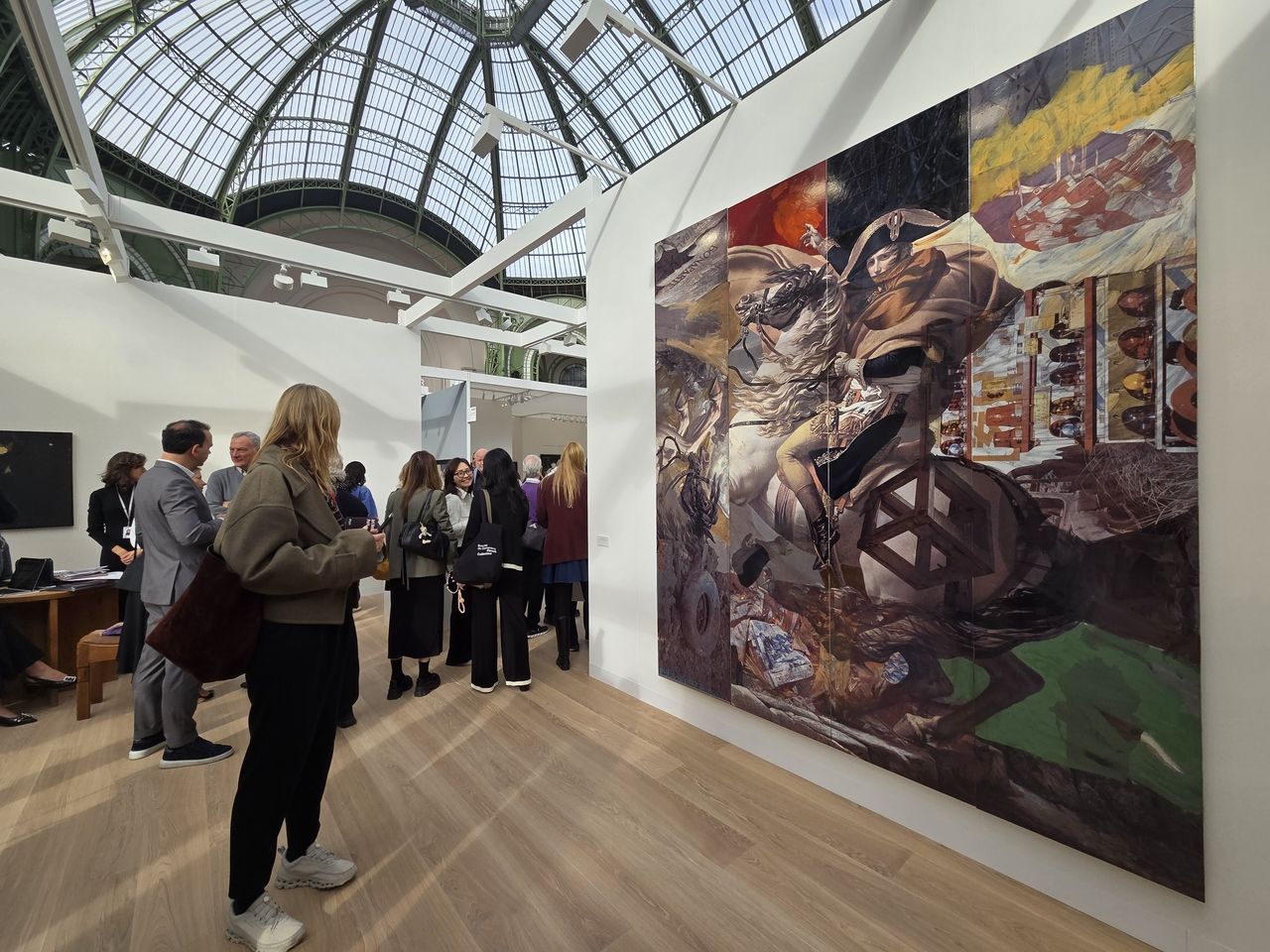 Visitors to the Thaddaeus Ropac's booth at Art Basel Paris 2025 look around the works on display on Wednesday at the Grand Palais in Paris. (Park Yuna/The Korea Herald)