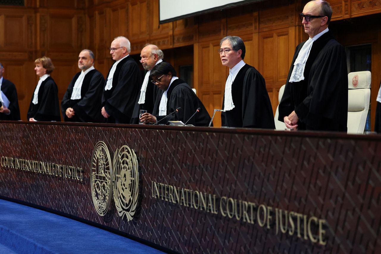 Judges arrive for the session of the International Court of Justice in The Hague, Netherlands, Wednesday. (Reuters-Yonhap)