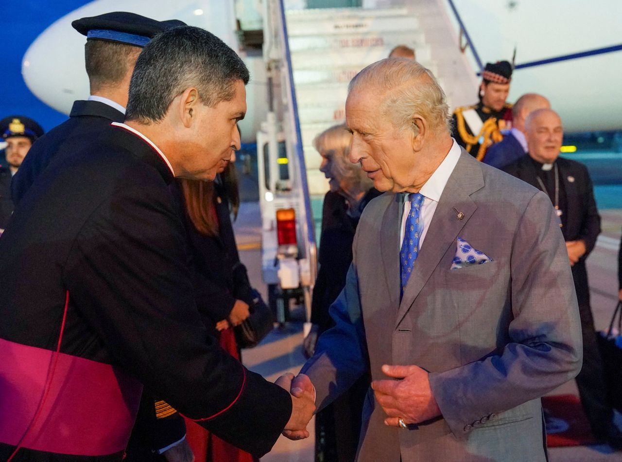 Britain's King Charles III is greeted by a member of the clergy as he arrives in Rome, Wednesday. (Reuters-Yonhap)