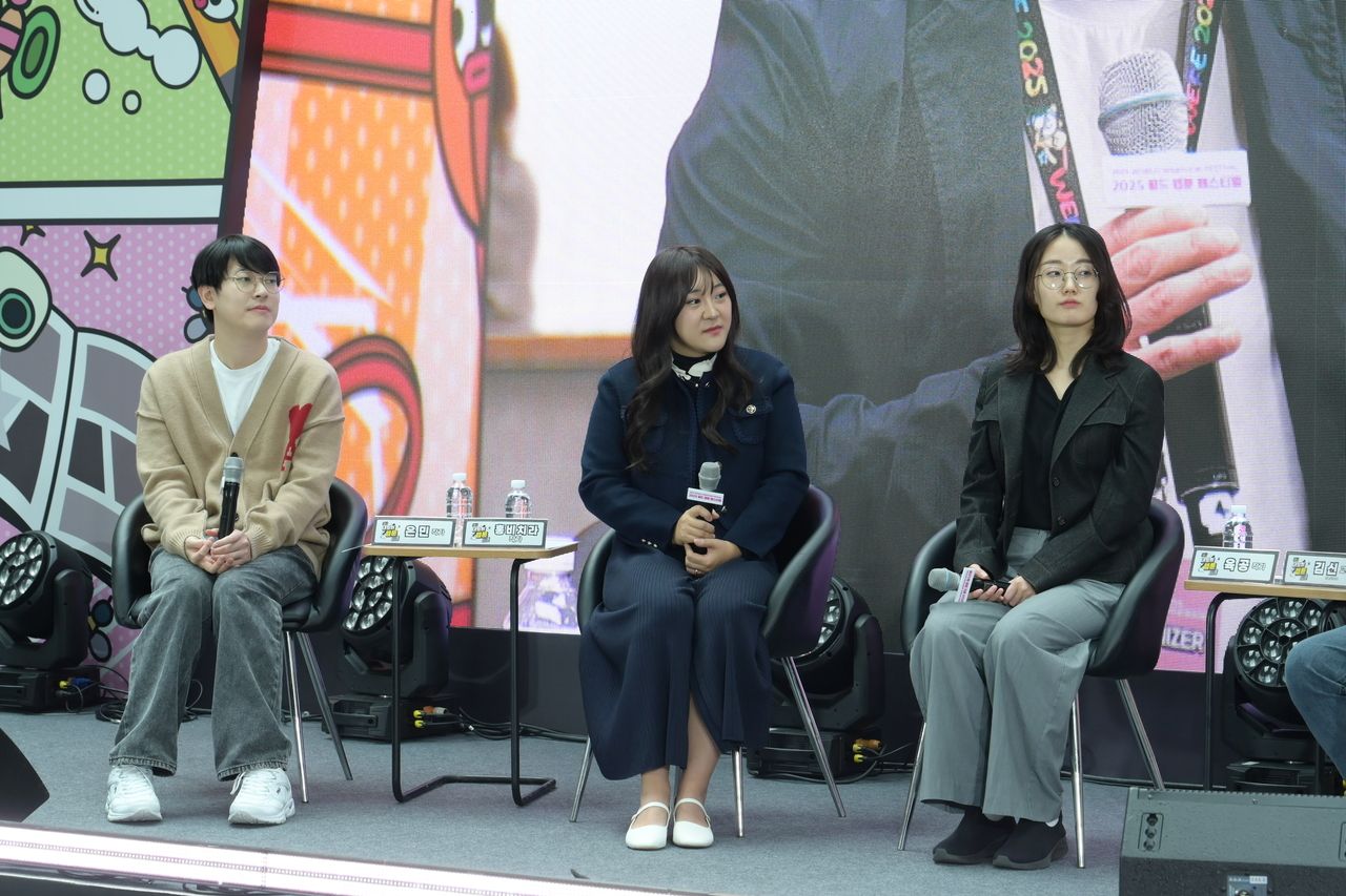 (From left) Gu Eun-min, Hong Bicira and Jeong Hye Won, also known as Yookgong, participate in a talk session Tuesday at Lotte World Ice Link in Jamsil during the 2025 World Webtoon Festival. (KOCCA)