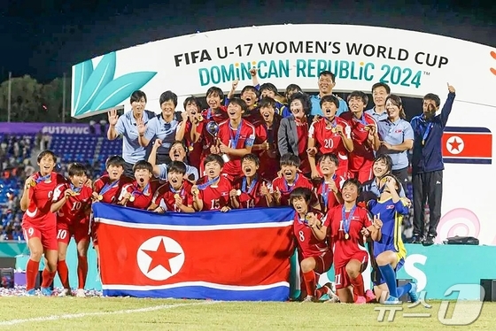 North Korea\'s Women\'s U17 National Football Team. Photo shows the team celebrating their championship win last year / Rodong Sinmun