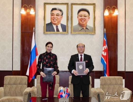  Bella Mukharbieva Cherkesova, Russian Deputy Minister of Mass Media, and Shin Hong-chul, North Korean Ambassador to Russia, signing the agreement / Telegram of Russian Embassy in North Korea