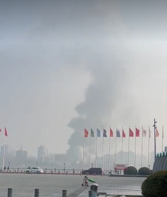 On December 7, footage showing smoke rising over Sinuiju, North Korea, across the Yalu River, was posted on X (formerly Twitter) from a square in Dandong, Liaoning Province, China, near the North Korea-China border / Capture from X