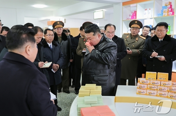  Kim Jong Un, General Secretary of the Workers\' Party of Korea, inspecting a factory during his attendance at the completion ceremony for a local industrial factory in Changyon County on December 18 / Rodong Sinmun