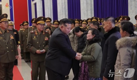 Kim Jong Un, General Secretary of the Workers\' Party of Korea, is consoling the bereaved families of fallen soldiers at the Wall of Remembrance in the Central Hall of the April 25 Cultural Center / Capture from Korean Central Television