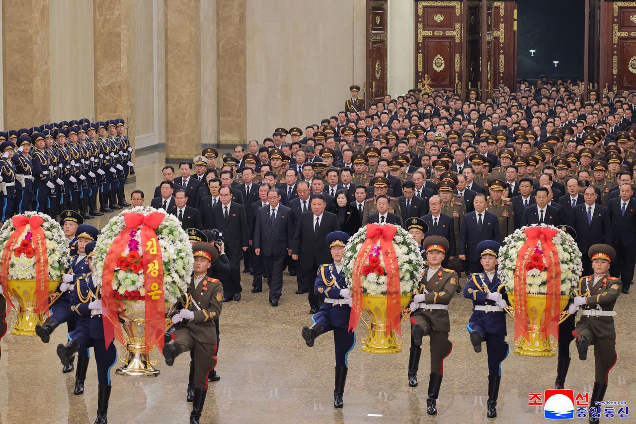 North Korean leader Kim Jong-un, at the head of procession, visits the Kumsusan Palace of the Sun in Pyongyang on Wednesday, to mark the 14th anniversary of his father and late leader Kim Jong-il's death. (KCNA via Yonhap)