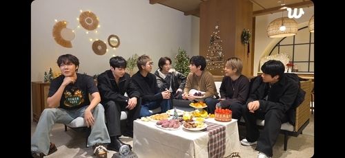 BTS members talk during a livestream on Weverse on Sunday, in this captured image from the platform. (Weverse)