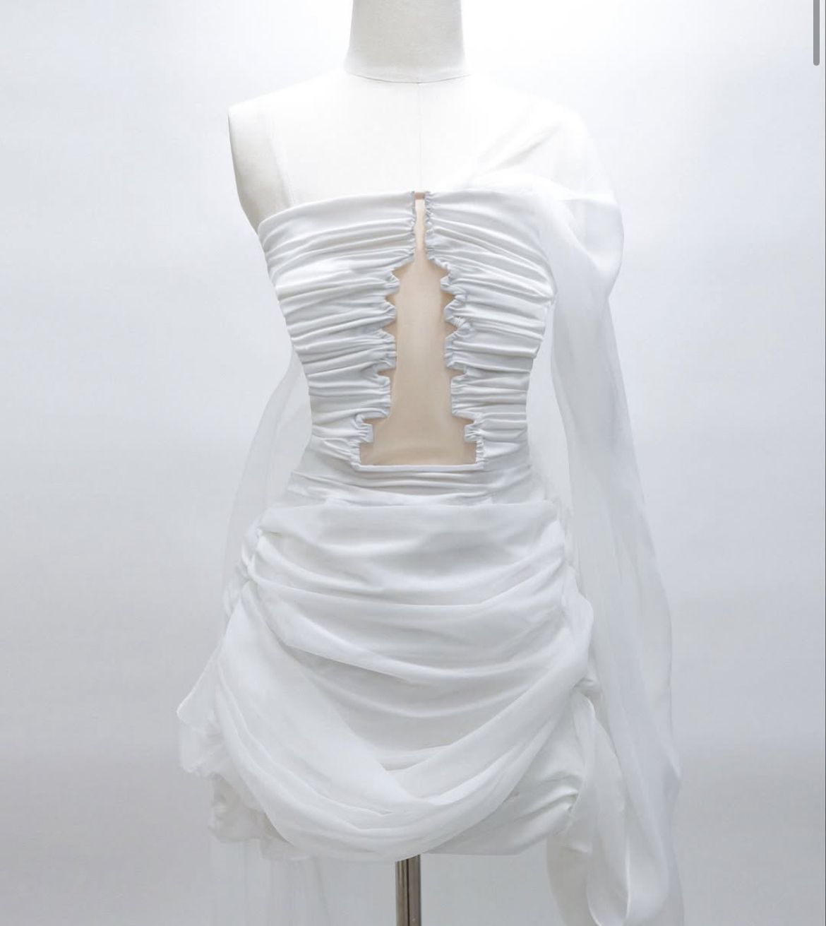 White tube-top mini dress featuring a central cutout inspired by the proportions of Bulguksa’s Three-story Stone Pagoda from Le Je (Instagram)