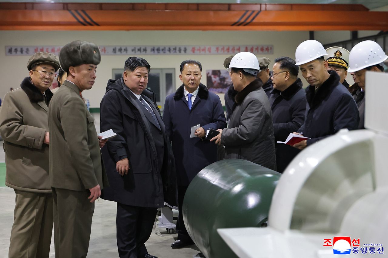North Korean leader Kim Jong Un visits the construction site of an 8,700-ton nuclear-powered submarine capable of launching surface-to-air missiles in this picture released by North Korea's official Korean Central News Agency on Dec. 25. (KCNA via Yonhap)