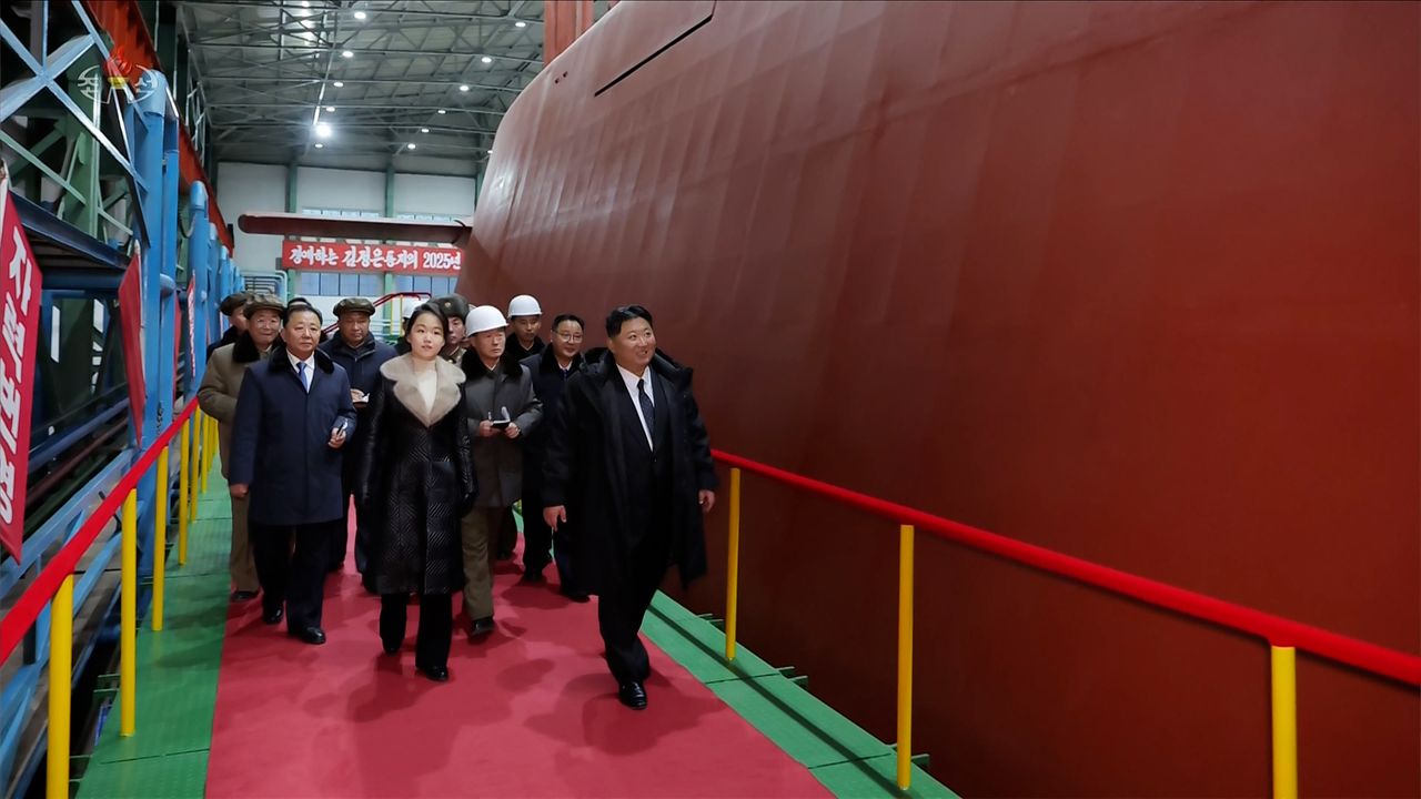 North Korean leader Kim Jong-un inspected the building site of the 8,700-ton nuclear-powered submarine under construction. Kim's daughter, Kim Ju-ae, was also on site. (KCNA via Yonhap)