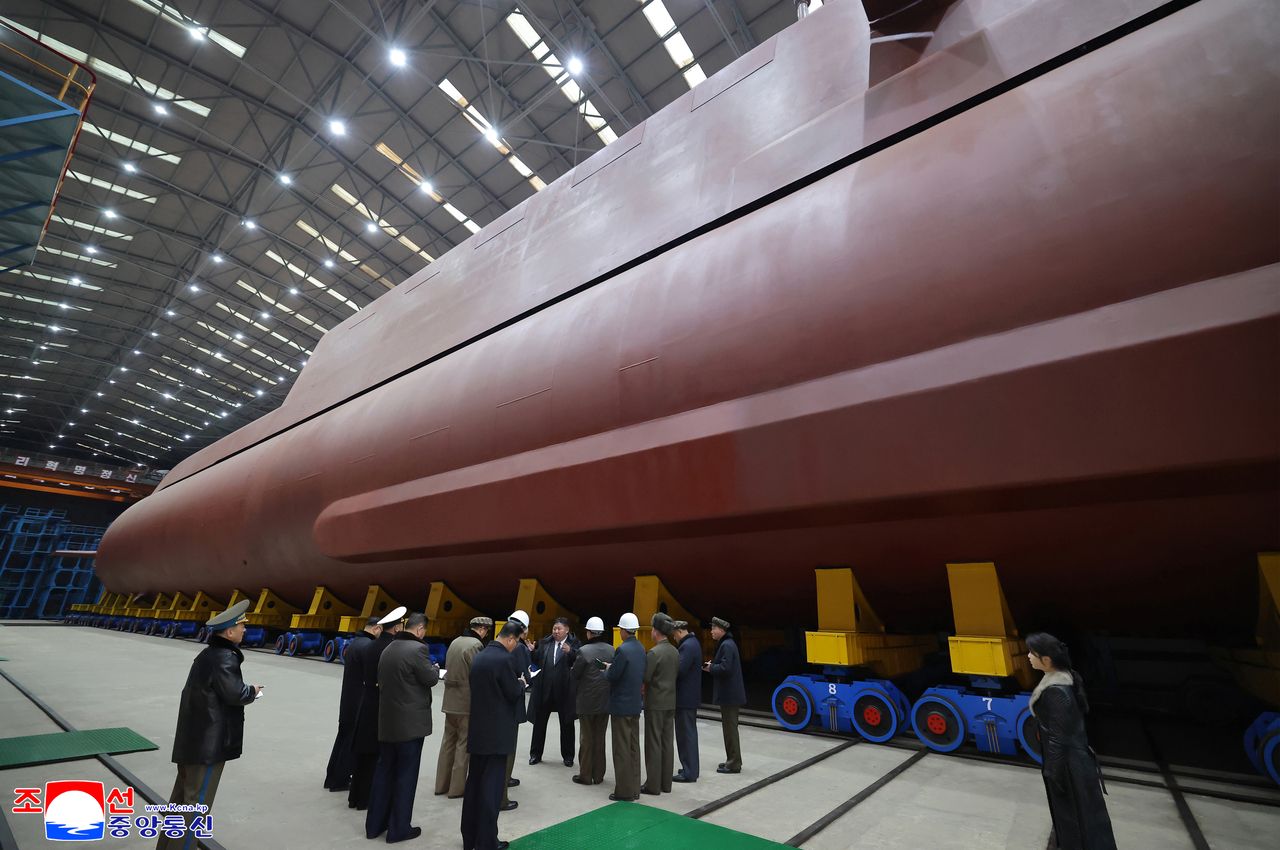 North Korean leader Kim Jong-un inspected the building site of the 8,700-ton nuclear-powered submarine under construction. Kim's daughter, Kim Ju-ae, was also on site. (KCNA via Yonhap)