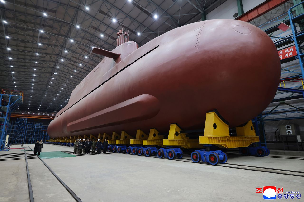 This photo, published by the KCNA on Thursday shows an 8,700-ton nuclear-powered strategic guided missile submarine under construction. North Korean leader Kim Jong-un inspected its building site, the news agency said. (KCNA-Yonhap)