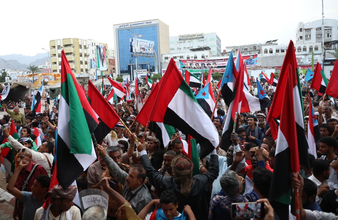 People wave South Yemen and UAE flags during a protest against Saudi Arabia in the southern port city of Aden, Yemen, Tuesday. (EPA-Yonhap)