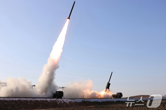 The site of the test firing to verify the effectiveness of the upgraded large-caliber multiple rocket launcher system conducted by North Korea\'s Missile Bureau on Tuesday / Rodong Sinmun