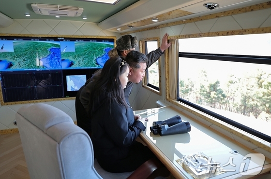 Kim Jong Un, General Secretary of the Workers\' Party of Korea, and his daughter Ju-ae attended the test firing of a large-caliber multiple rocket launcher system conducted by the Missile Bureau on Tuesday / Rodong Sinmun