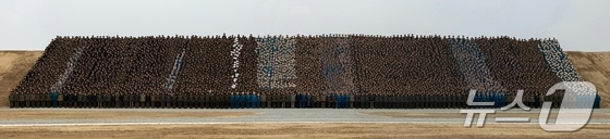 The Rodong Sinmun, the official newspaper of North Korea\'s Workers\' Party, reported on Monday that General Secretary Kim Jong Un attended the completion ceremony for the Sinuiju Greenhouse Complex Farm held the previous day. The newspaper described the farm as another proud, monumental creation bearing witness to the great transformation of the Kim era and as a glorious gift of loyalty presented by the young builders to the 9th Congress of the Workers\' Party of Korea / Rodong Sinmun