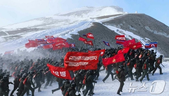 The Rodong Sinmun, the official newspaper of North Korea\'s Workers\' Party, reported on Thursday that the national youth and student expeditionary march to the revolutionary historic sites in the Paektu Mountain region ascended Mount Paektu the previous day / Rodong Sinmun