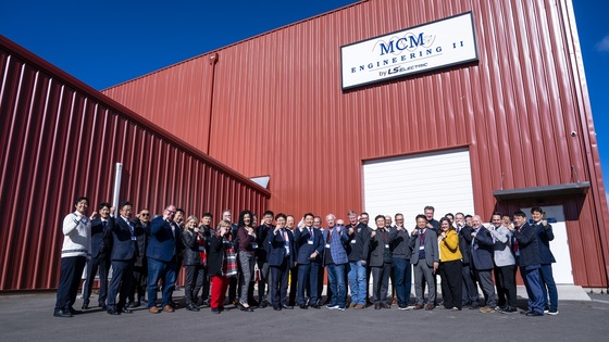 Employees of LS ELECTRIC and MCM Engineering II pose for a commemorative photo at a local production facility. / Courtesy of LS ELECTRIC