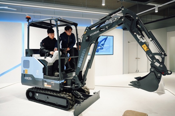 HD Construction Equipment Eumseong Global Training Center: Employees practicing operation while riding mini electric excavators / Provided by HD Construction Equipment