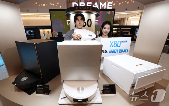 Models introduce newly launched products, including the X60 series robot vacuum, at a Dreame pop-up store. March 25, 2026. / Courtesy of News1