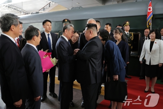 Kim Jong Un, General Secretary of the Workers\' Party of Korea, arriving in Beijing on September 3 last year for the North Korea-China summit and being greeted by Wang Yi, China\'s Foreign Minister / Rodong Sinmun