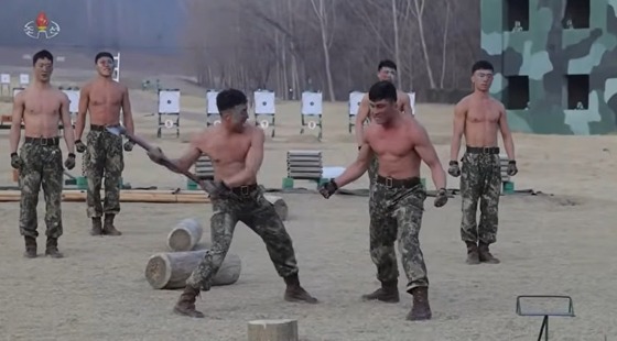 On March 29, Korean Central Television reported on a demonstration performed by combatants in front of Kim Jong Un, General Secretary of the Workers\' Party of Korea. The demonstration showed them deflecting an axe using their abdominal muscles / Capture from Korean Central Television (KCTV)