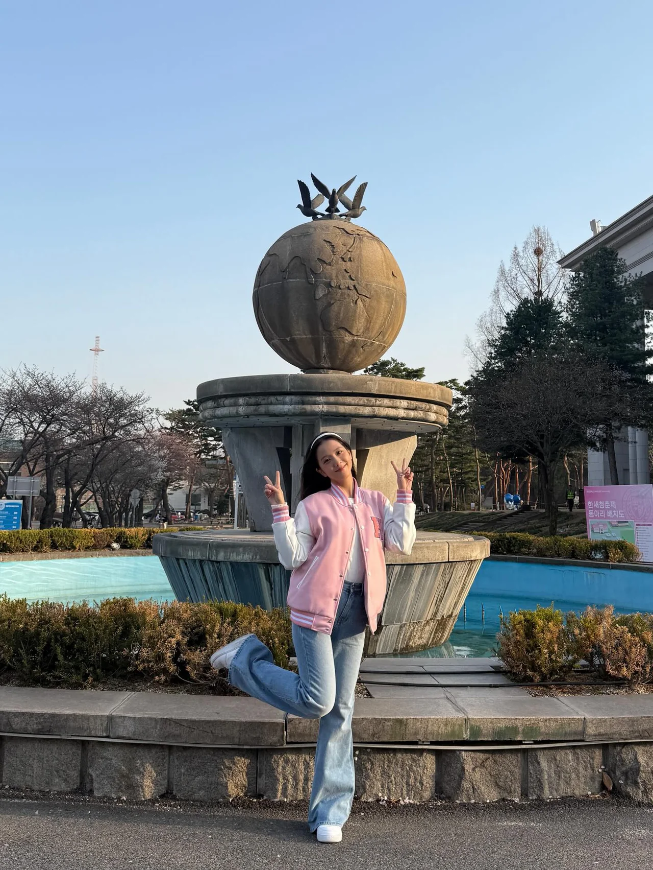 Spring Campus Style: How BLACKPINK’s Jisoo Rocks the Pink Varsity Jacket Look