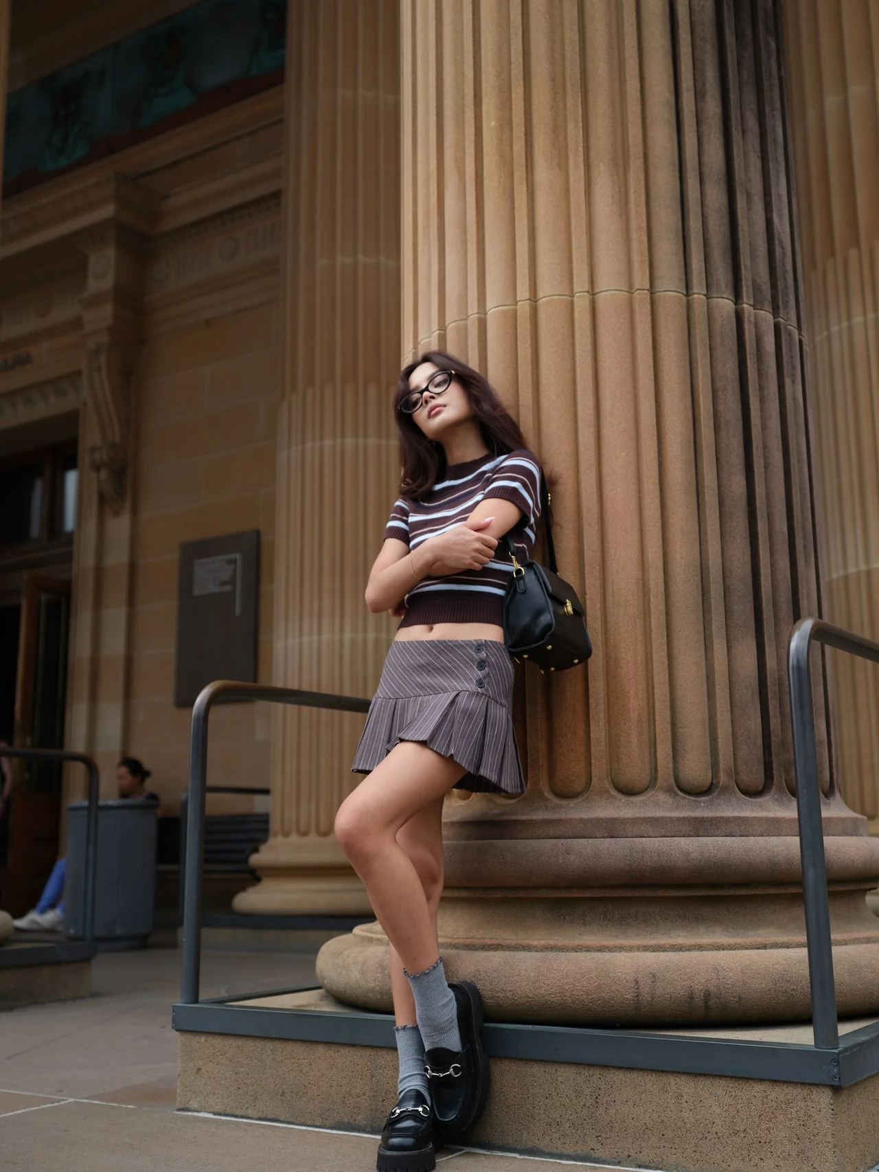 Gray suit vest | She layers a neat vest over a sheer polka-dot top for a surprising twist /Photo: Lily May Mac Instagram