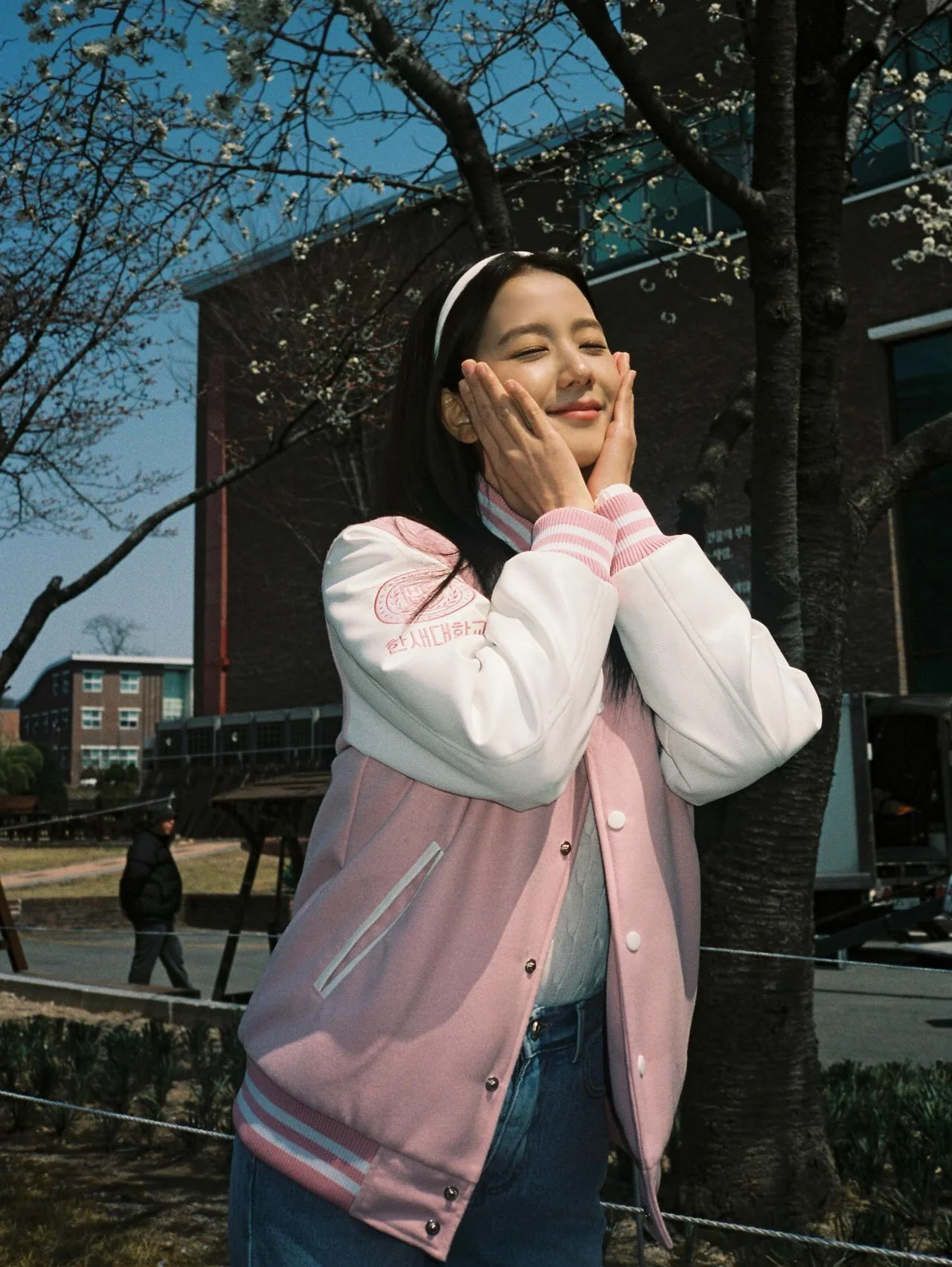 Pink varsity jacket | A fresh freshman look finished with a bright pink tone and white sleeve accents / Photo: Jisoo\'s Instagram