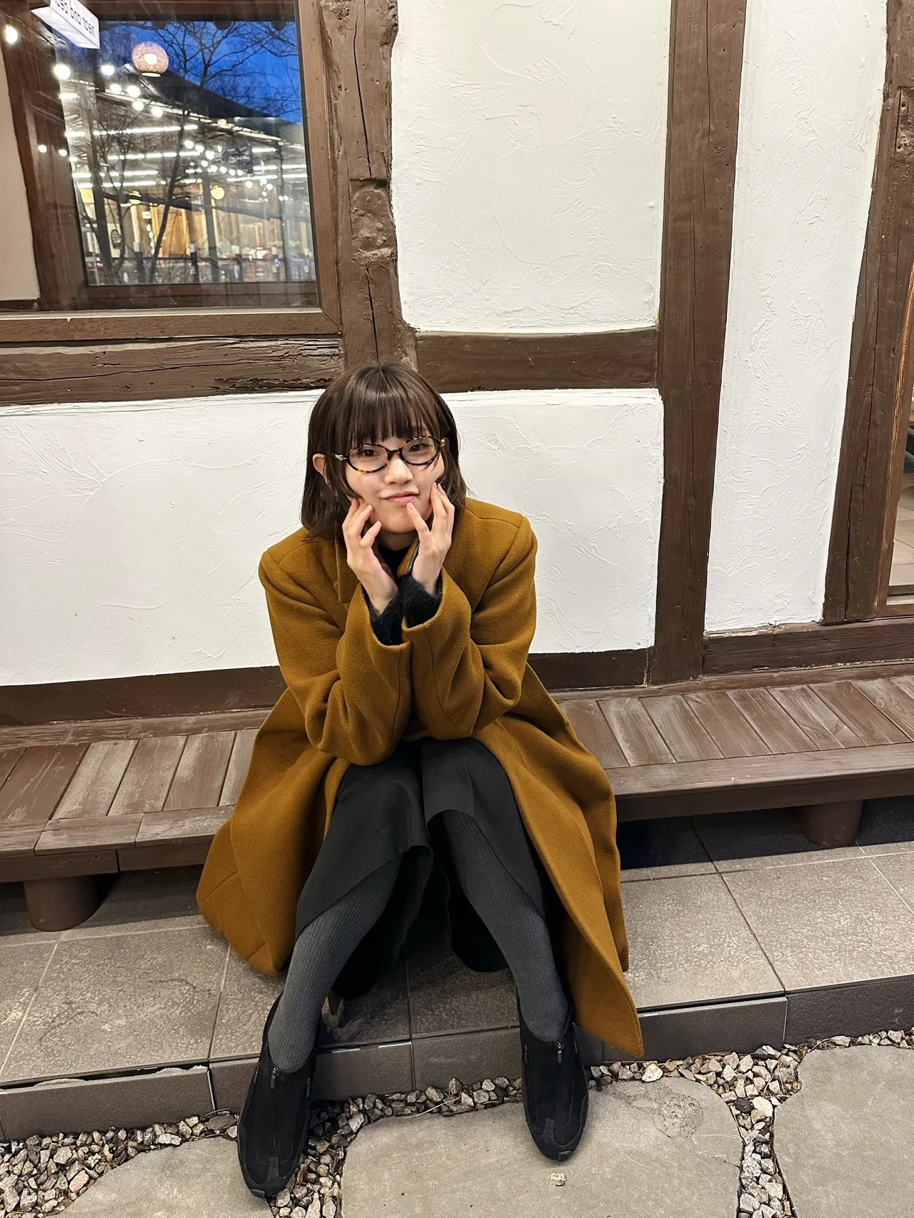 Brown long coat | A muted brown hue with a pop of blue creates a harmonious silhouette /photo=Park So-dam\'s Instagram