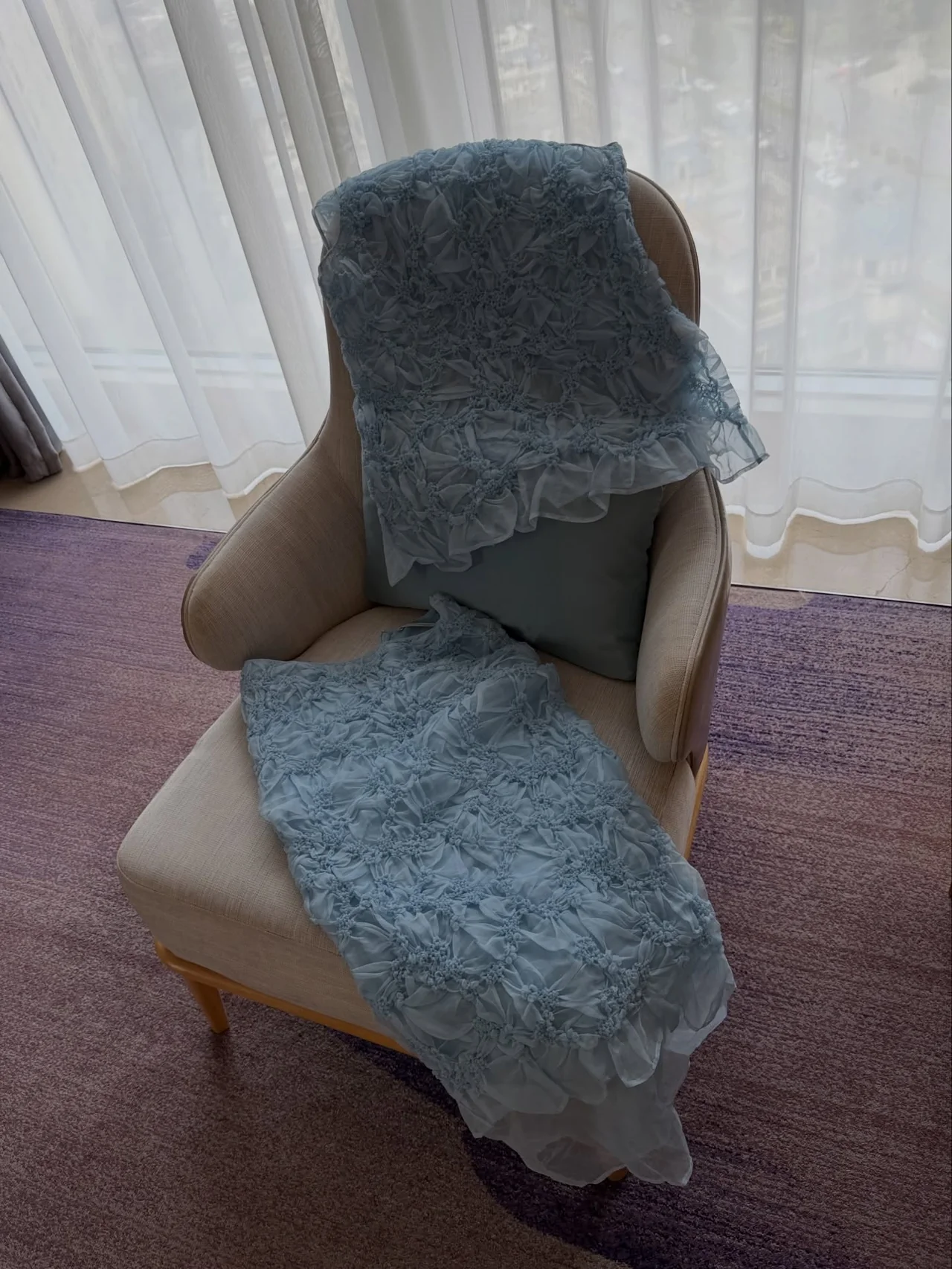 &nbsp;     Cecilie Bahnsen blue-gray ruffle-flower organza dress, shown as an object draped over a chair before wearing / Photo: Hyomin\'s Instagram